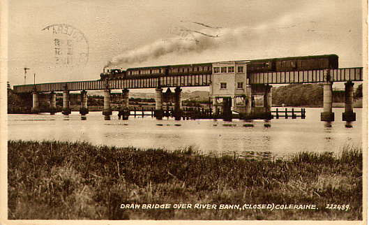 A steam train crosses the bridge. Note the position of the control cabin mounted on the bridge side.